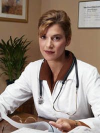Doctor sitting at her office desk
