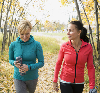 Two women taking a walk in the woods