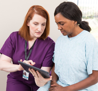 Female doctor talking with female patient
